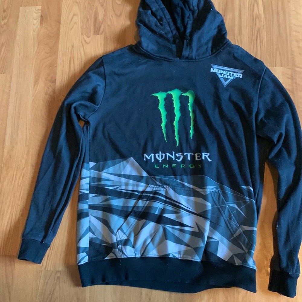 This is a monster jam hoodie with monster energy on it.